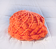 complementos/gorro_bebe_naranja.png